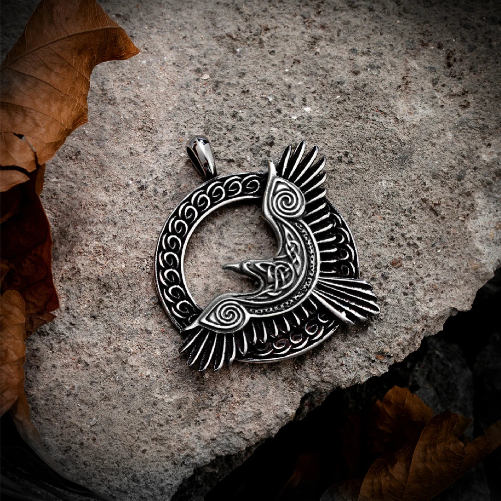 Intricate craftsmanship of Odin’s Raven Flight Necklace’s pendant captured in natural light, focusing on the symbolic representation of thought and memory from Norse myths.