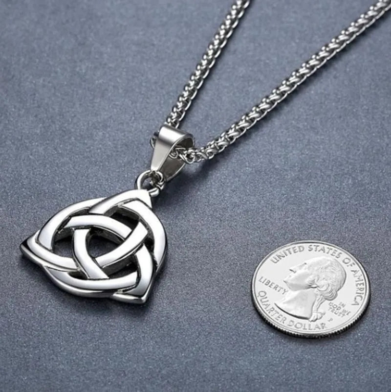 Detailed view of the Celtic Trinity Knot pendant's seamless lines and loops, representing the interconnectedness of earth, sea, and sky in Celtic mythology.