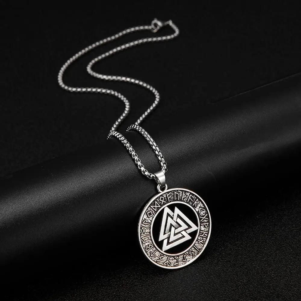 Close-up view of the Valknut Rune Circle Necklace pendant, highlighting the three interlocked triangles and encircling runes, symbolizing Norse spiritual journey and transformation.