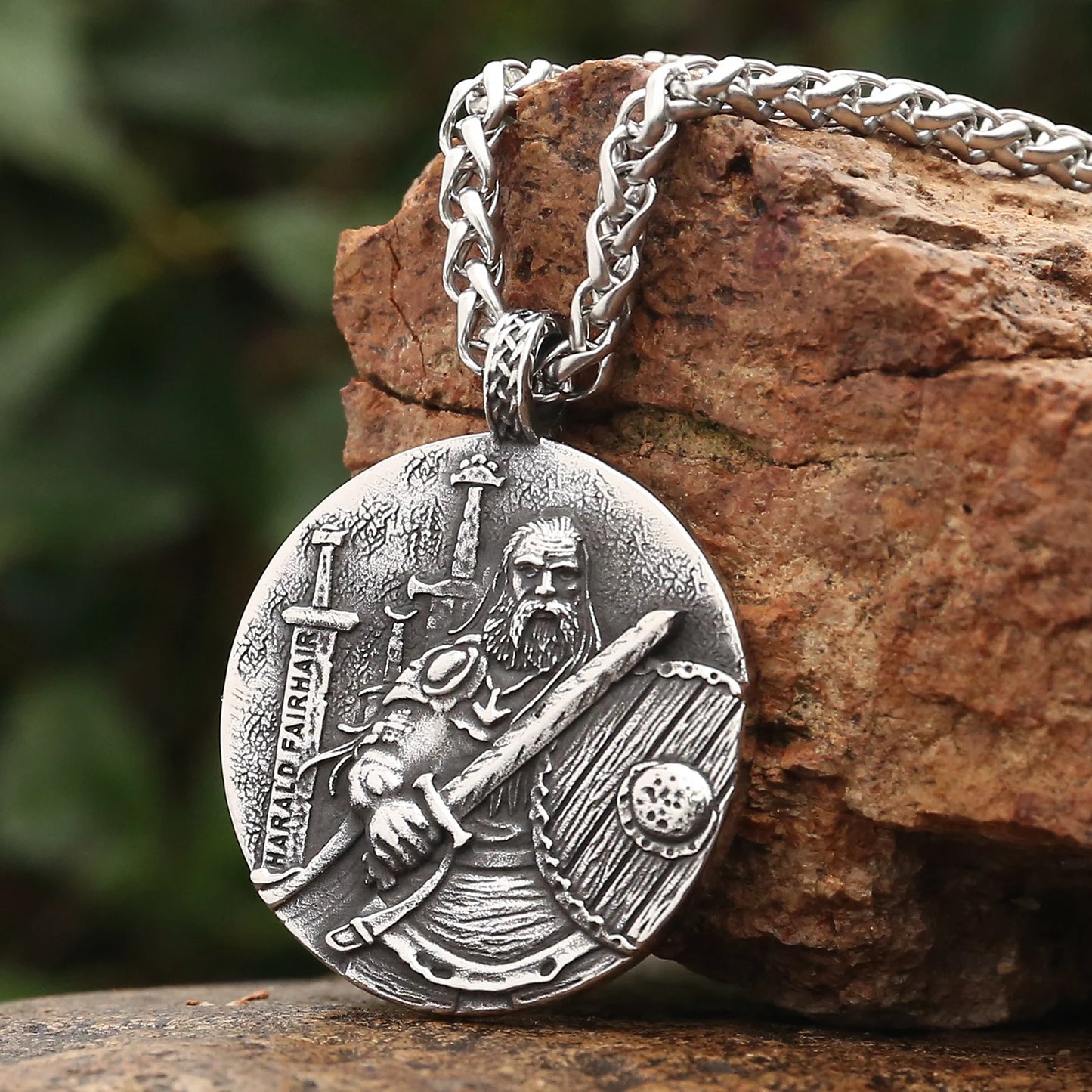 Close-up of the stainless steel King Harald pendant from the Viking Kings Legacy Necklace Collection, showcasing intricate Norse engravings.