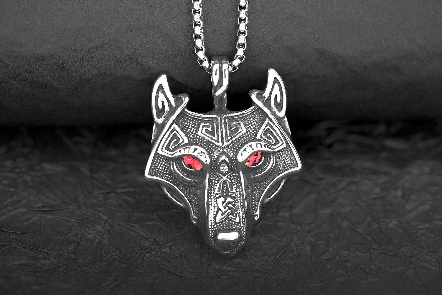 Stylish display of the Fenris Wolf necklace with green glowing eyes on a durable stainless steel chain, symbolizing Norse mythology's wild spirit.