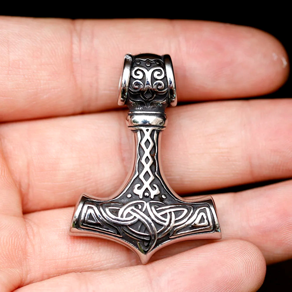 Detailed close-up of Thor's Mighty Mjöllnir Necklace featuring rust-free and fade-free stainless steel craftsmanship with ancient Norse design elements.