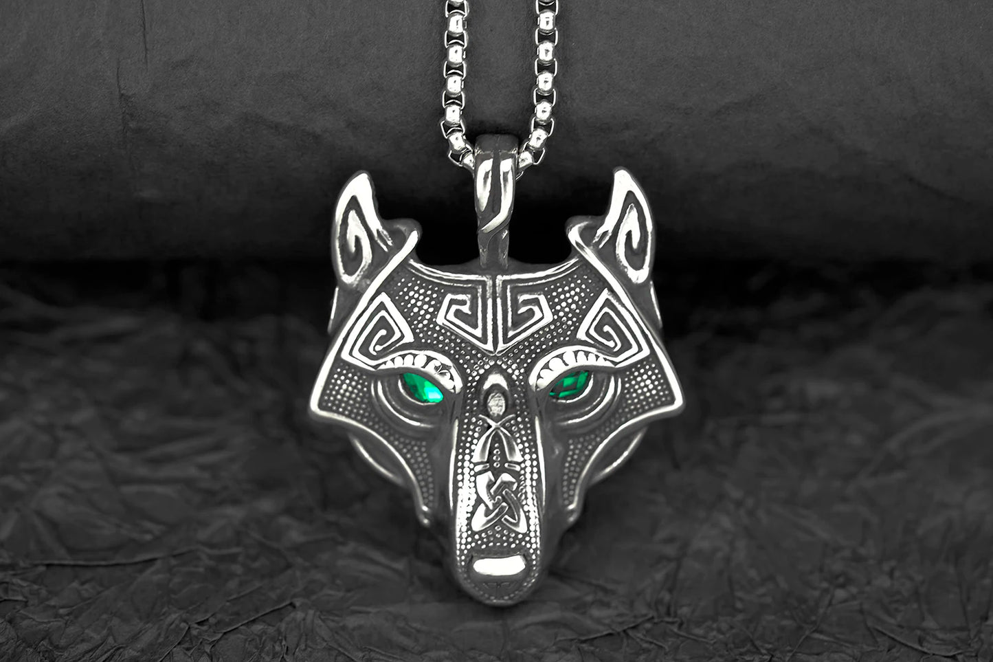 Lifestyle image of a person wearing the Fenris Wolf Luminary Pendant with black eyes, demonstrating its bold and commanding presence in a casual setting.