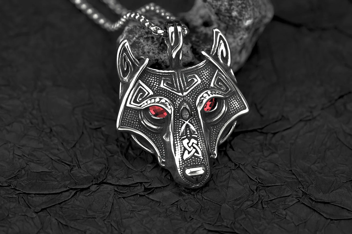 Close-up of Fenris Wolf Luminary Pendant with glowing blue eyes, highlighting the intricate zinc alloy craftsmanship and fierce design.