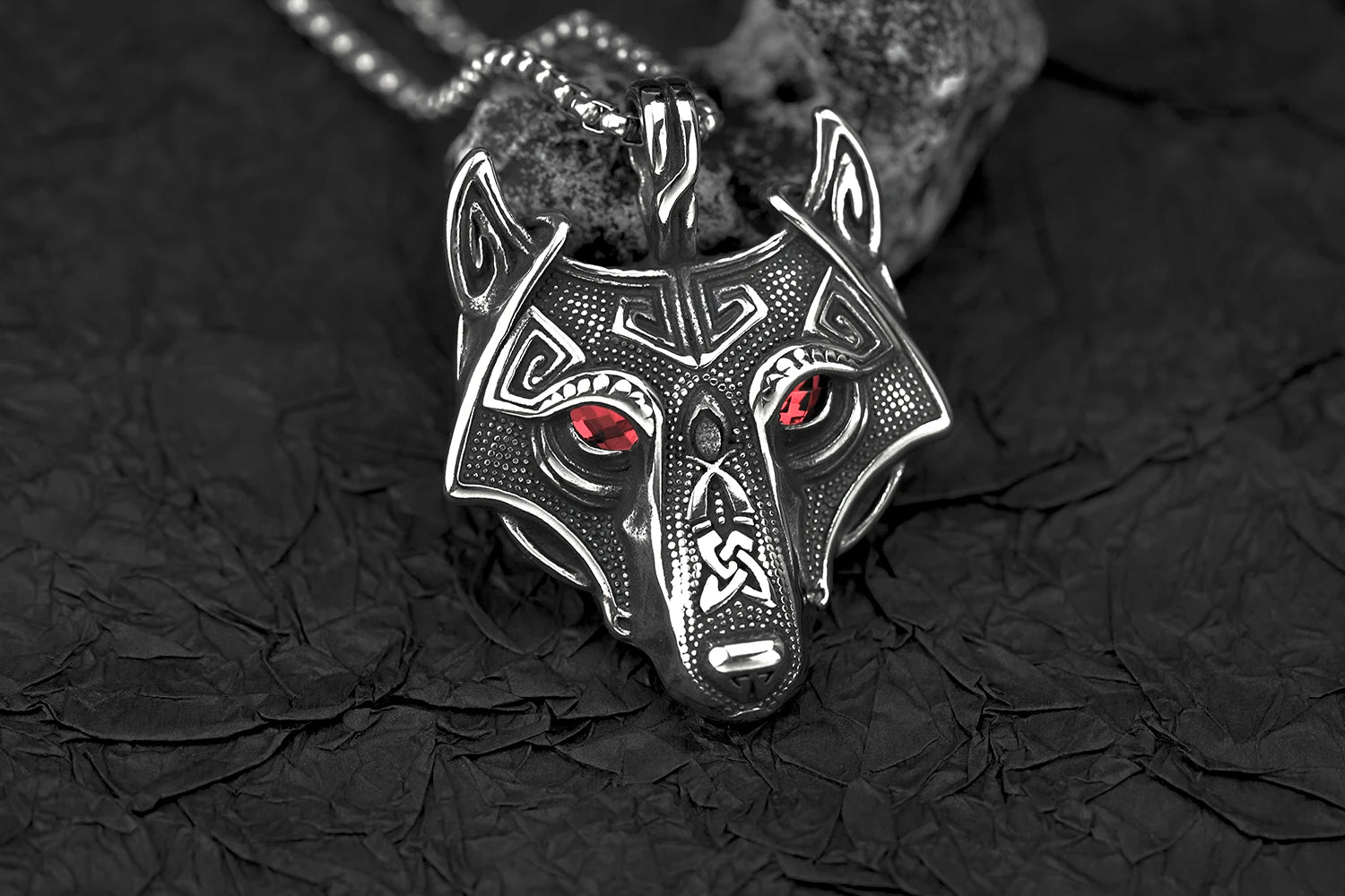 Close-up of Fenris Wolf Luminary Pendant with glowing blue eyes, highlighting the intricate zinc alloy craftsmanship and fierce design.