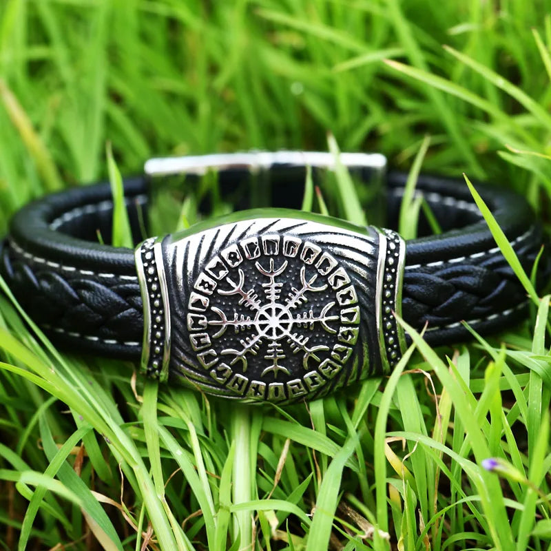 Elegant display of the Vegvisir bracelet on a rustic wooden surface, highlighting the leather band and hidden-safety-clasp for secure fit.